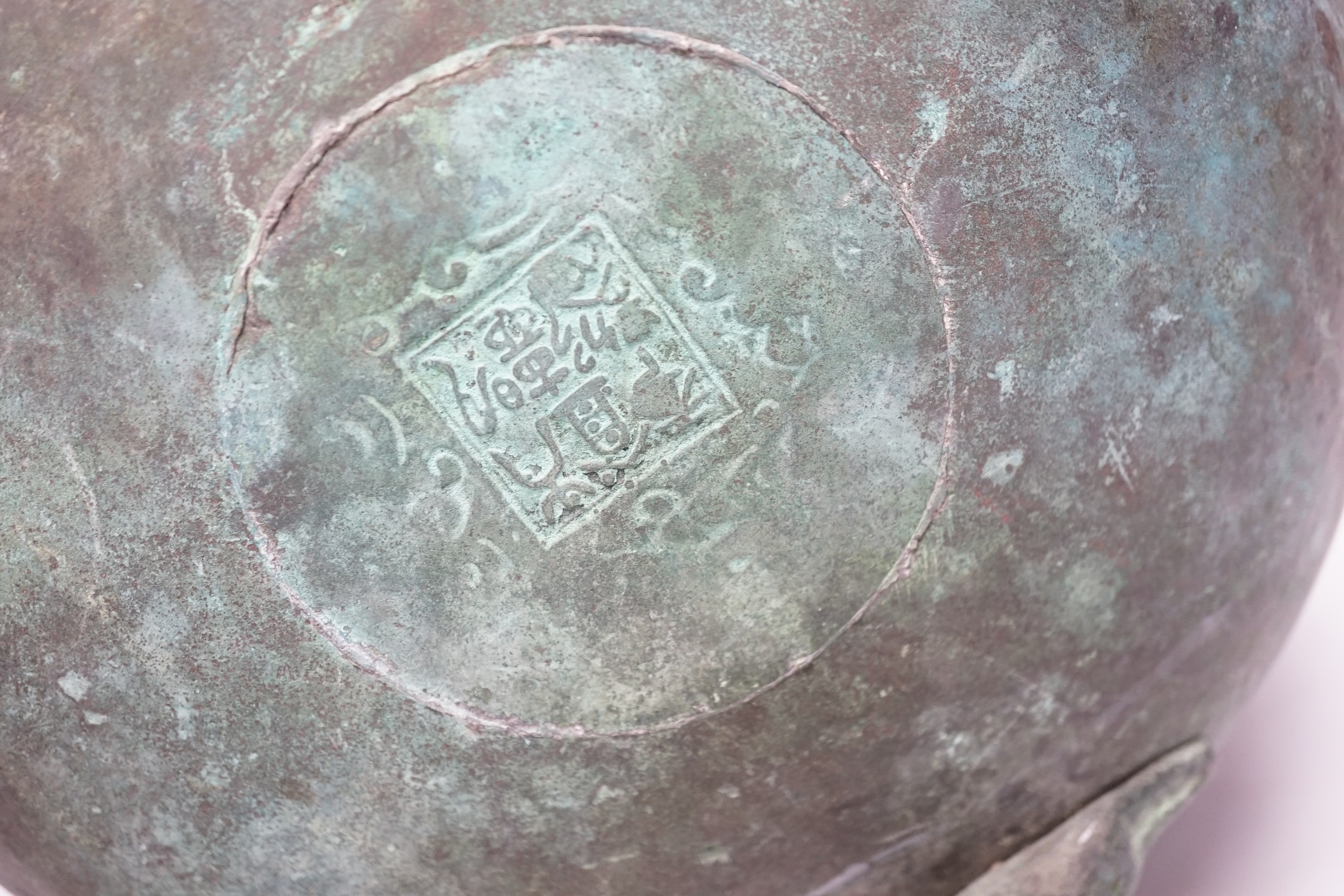 A large Chinese parcel gilt bronze tripod censer, 24.5cm high, 25cm diameter. Condition - fair